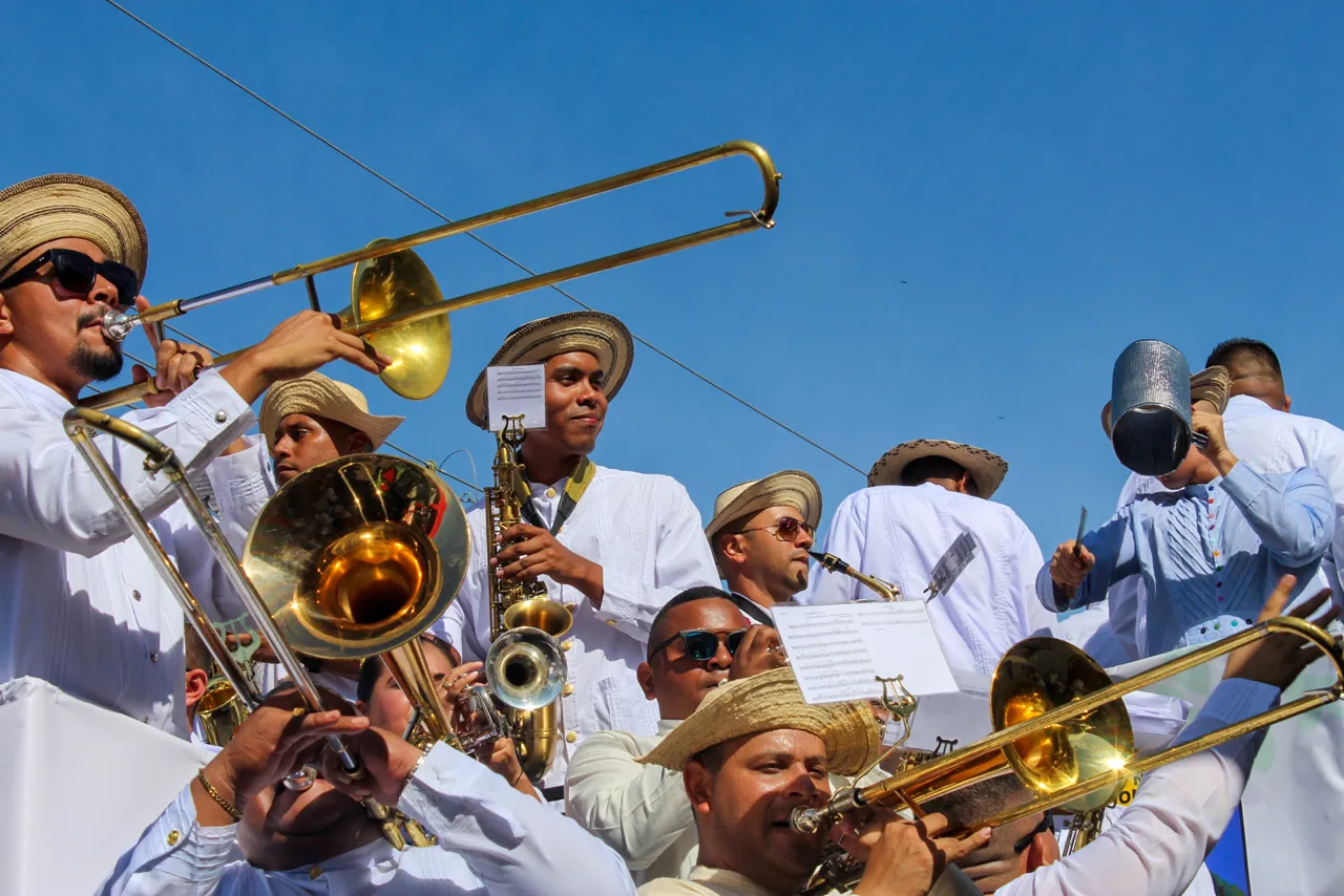 A murga, a carnival brass band, in straw hats