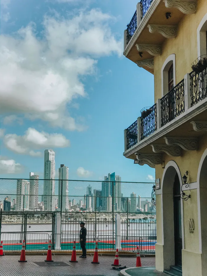 A colonial facade against the skyscrapers of Panama City